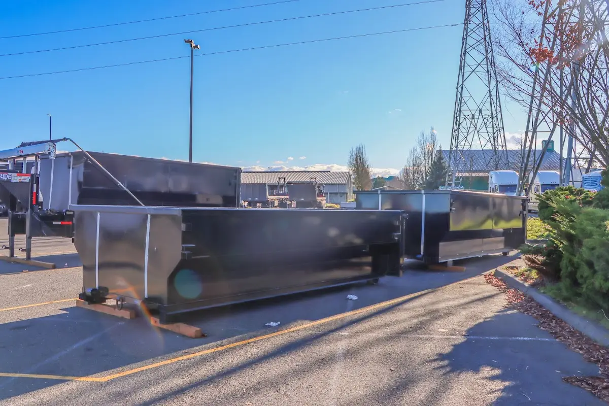 Roll-off dumpster ready for waste disposal at job site for Yard Waste Dumpster Rental in Orchards